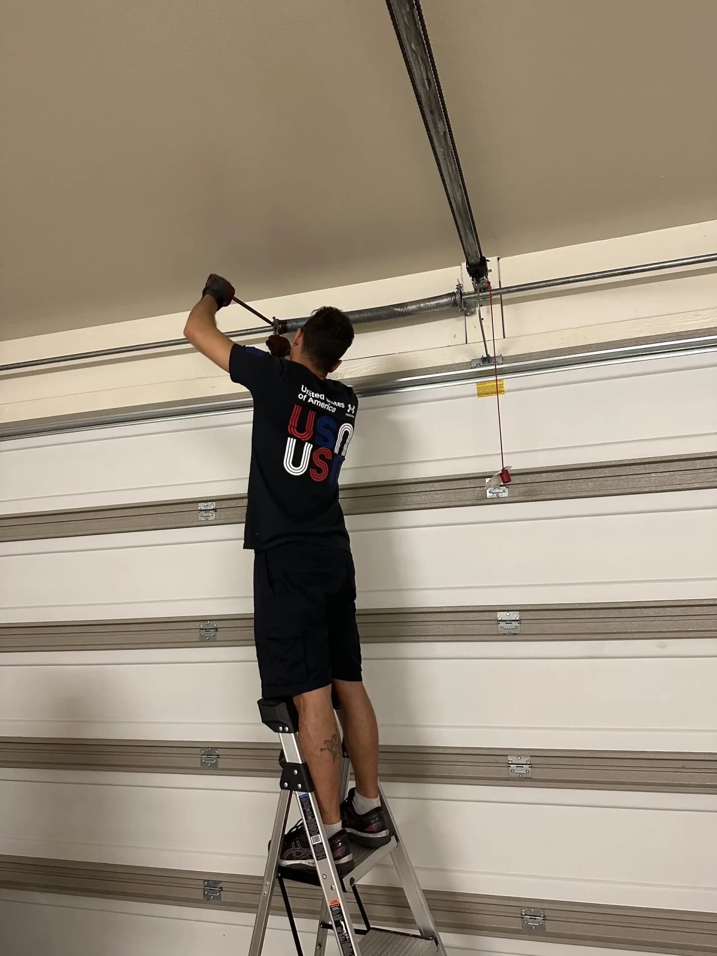 A Cactus Garage Door Repair technician on a job in Arizona